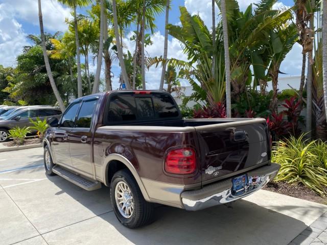 2002 Toreador Red Metallic /Dark Brown Ford F-150 CREW CAB King Ranch LOW MILES 56,886 (1FTRW07L12K) with an 5.4L SEFI OHC V8 Triton Engine engine, Automatic transmission, located at 4701 North Dixie Hwy, Pompano Beach, FL, 33064, (954) 422-2889, 26.240938, -80.123474 - OUR WEBPAGE FLORIDACARS1.COM HAS OVER 100 PHOTOS AND FREE CARFAX LINK 2002 Ford F-150 King Ranch Crew Pickup 5.4L V8 F SOHC 16V Gasoline 19 MPG Rear Wheel Drive Features ABS Brakes Air Conditioning Alloy Wheels AM/FM Stereo Automatic Transmission Bed Liner Cassette Player Cruise Control Leather Seat - Photo#5