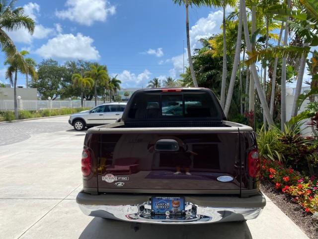 2002 Toreador Red Metallic /Dark Brown Ford F-150 CREW CAB King Ranch LOW MILES 56,886 (1FTRW07L12K) with an 5.4L SEFI OHC V8 Triton Engine engine, Automatic transmission, located at 4701 North Dixie Hwy, Pompano Beach, FL, 33064, (954) 422-2889, 26.240938, -80.123474 - OUR WEBPAGE FLORIDACARS1.COM HAS OVER 100 PHOTOS AND FREE CARFAX LINK 2002 Ford F-150 King Ranch Crew Pickup 5.4L V8 F SOHC 16V Gasoline 19 MPG Rear Wheel Drive Features ABS Brakes Air Conditioning Alloy Wheels AM/FM Stereo Automatic Transmission Bed Liner Cassette Player Cruise Control Leather Seat - Photo#6