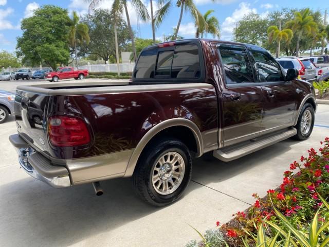 2002 Toreador Red Metallic /Dark Brown Ford F-150 CREW CAB King Ranch LOW MILES 56,886 (1FTRW07L12K) with an 5.4L SEFI OHC V8 Triton Engine engine, Automatic transmission, located at 4701 North Dixie Hwy, Pompano Beach, FL, 33064, (954) 422-2889, 26.240938, -80.123474 - OUR WEBPAGE FLORIDACARS1.COM HAS OVER 100 PHOTOS AND FREE CARFAX LINK 2002 Ford F-150 King Ranch Crew Pickup 5.4L V8 F SOHC 16V Gasoline 19 MPG Rear Wheel Drive Features ABS Brakes Air Conditioning Alloy Wheels AM/FM Stereo Automatic Transmission Bed Liner Cassette Player Cruise Control Leather Seat - Photo#7