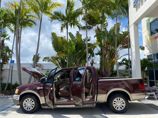 2002 Toreador Red Metallic /Dark Brown Ford F-150 CREW CAB King Ranch LOW MILES 56,886 (1FTRW07L12K) with an 5.4L SEFI OHC V8 Triton Engine engine, Automatic transmission, located at 4701 North Dixie Hwy, Pompano Beach, FL, 33064, (954) 422-2889, 26.240938, -80.123474 - OUR WEBPAGE FLORIDACARS1.COM HAS OVER 100 PHOTOS AND FREE CARFAX LINK 2002 Ford F-150 King Ranch Crew Pickup 5.4L V8 F SOHC 16V Gasoline 19 MPG Rear Wheel Drive Features ABS Brakes Air Conditioning Alloy Wheels AM/FM Stereo Automatic Transmission Bed Liner Cassette Player Cruise Control Leather Seat - Photo#8