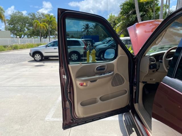2002 Toreador Red Metallic /Dark Brown Ford F-150 CREW CAB King Ranch LOW MILES 56,886 (1FTRW07L12K) with an 5.4L SEFI OHC V8 Triton Engine engine, Automatic transmission, located at 4701 North Dixie Hwy, Pompano Beach, FL, 33064, (954) 422-2889, 26.240938, -80.123474 - OUR WEBPAGE FLORIDACARS1.COM HAS OVER 100 PHOTOS AND FREE CARFAX LINK 2002 Ford F-150 King Ranch Crew Pickup 5.4L V8 F SOHC 16V Gasoline 19 MPG Rear Wheel Drive Features ABS Brakes Air Conditioning Alloy Wheels AM/FM Stereo Automatic Transmission Bed Liner Cassette Player Cruise Control Leather Seat - Photo#9