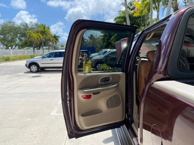 2002 Toreador Red Metallic /Dark Brown Ford F-150 CREW CAB King Ranch LOW MILES 56,886 (1FTRW07L12K) with an 5.4L SEFI OHC V8 Triton Engine engine, Automatic transmission, located at 4701 North Dixie Hwy, Pompano Beach, FL, 33064, (954) 422-2889, 26.240938, -80.123474 - OUR WEBPAGE FLORIDACARS1.COM HAS OVER 100 PHOTOS AND FREE CARFAX LINK 2002 Ford F-150 King Ranch Crew Pickup 5.4L V8 F SOHC 16V Gasoline 19 MPG Rear Wheel Drive Features ABS Brakes Air Conditioning Alloy Wheels AM/FM Stereo Automatic Transmission Bed Liner Cassette Player Cruise Control Leather Seat - Photo#13