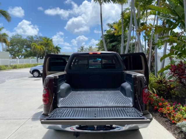 2002 Toreador Red Metallic /Dark Brown Ford F-150 CREW CAB King Ranch LOW MILES 56,886 (1FTRW07L12K) with an 5.4L SEFI OHC V8 Triton Engine engine, Automatic transmission, located at 4701 North Dixie Hwy, Pompano Beach, FL, 33064, (954) 422-2889, 26.240938, -80.123474 - OUR WEBPAGE FLORIDACARS1.COM HAS OVER 100 PHOTOS AND FREE CARFAX LINK 2002 Ford F-150 King Ranch Crew Pickup 5.4L V8 F SOHC 16V Gasoline 19 MPG Rear Wheel Drive Features ABS Brakes Air Conditioning Alloy Wheels AM/FM Stereo Automatic Transmission Bed Liner Cassette Player Cruise Control Leather Seat - Photo#15