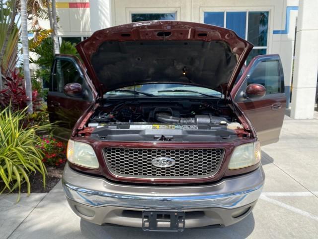 2002 Toreador Red Metallic /Dark Brown Ford F-150 CREW CAB King Ranch LOW MILES 56,886 (1FTRW07L12K) with an 5.4L SEFI OHC V8 Triton Engine engine, Automatic transmission, located at 4701 North Dixie Hwy, Pompano Beach, FL, 33064, (954) 422-2889, 26.240938, -80.123474 - OUR WEBPAGE FLORIDACARS1.COM HAS OVER 100 PHOTOS AND FREE CARFAX LINK 2002 Ford F-150 King Ranch Crew Pickup 5.4L V8 F SOHC 16V Gasoline 19 MPG Rear Wheel Drive Features ABS Brakes Air Conditioning Alloy Wheels AM/FM Stereo Automatic Transmission Bed Liner Cassette Player Cruise Control Leather Seat - Photo#17