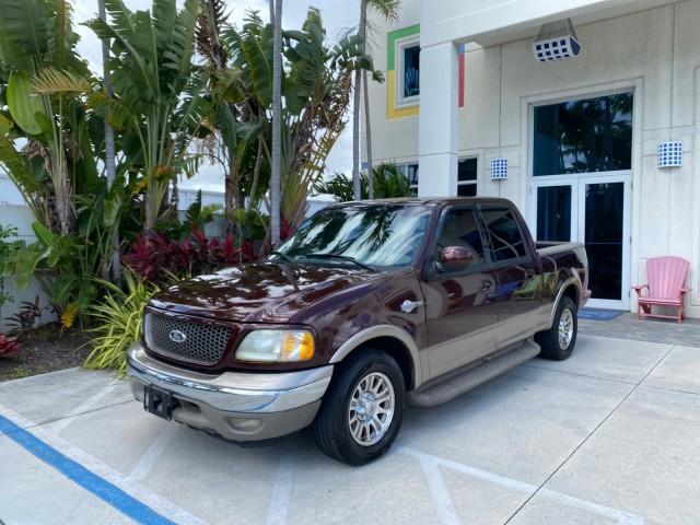 2002 Toreador Red Metallic /Dark Brown Ford F-150 CREW CAB King Ranch LOW MILES 56,886 (1FTRW07L12K) with an 5.4L SEFI OHC V8 Triton Engine engine, Automatic transmission, located at 4701 North Dixie Hwy, Pompano Beach, FL, 33064, (954) 422-2889, 26.240938, -80.123474 - OUR WEBPAGE FLORIDACARS1.COM HAS OVER 100 PHOTOS AND FREE CARFAX LINK 2002 Ford F-150 King Ranch Crew Pickup 5.4L V8 F SOHC 16V Gasoline 19 MPG Rear Wheel Drive Features ABS Brakes Air Conditioning Alloy Wheels AM/FM Stereo Automatic Transmission Bed Liner Cassette Player Cruise Control Leather Seat - Photo#28