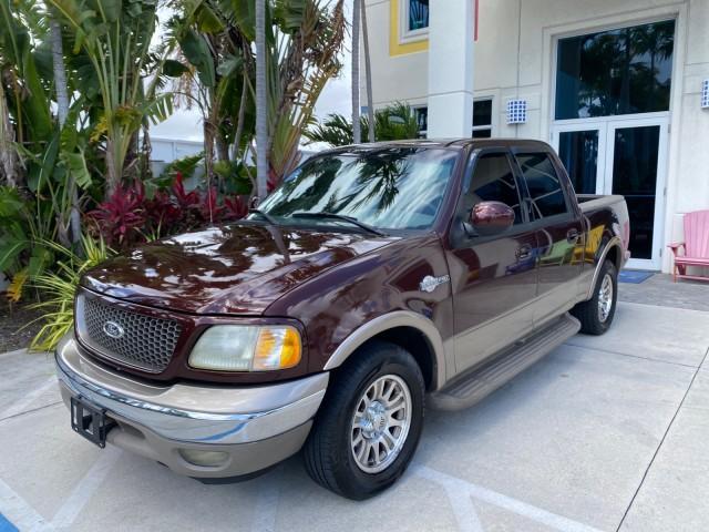 2002 Toreador Red Metallic /Dark Brown Ford F-150 CREW CAB King Ranch LOW MILES 56,886 (1FTRW07L12K) with an 5.4L SEFI OHC V8 Triton Engine engine, Automatic transmission, located at 4701 North Dixie Hwy, Pompano Beach, FL, 33064, (954) 422-2889, 26.240938, -80.123474 - OUR WEBPAGE FLORIDACARS1.COM HAS OVER 100 PHOTOS AND FREE CARFAX LINK 2002 Ford F-150 King Ranch Crew Pickup 5.4L V8 F SOHC 16V Gasoline 19 MPG Rear Wheel Drive Features ABS Brakes Air Conditioning Alloy Wheels AM/FM Stereo Automatic Transmission Bed Liner Cassette Player Cruise Control Leather Seat - Photo#29