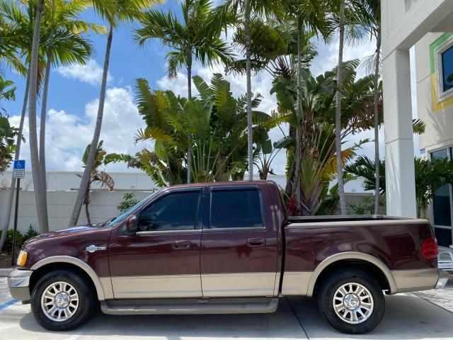 2002 Toreador Red Metallic /Dark Brown Ford F-150 CREW CAB King Ranch LOW MILES 56,886 (1FTRW07L12K) with an 5.4L SEFI OHC V8 Triton Engine engine, Automatic transmission, located at 4701 North Dixie Hwy, Pompano Beach, FL, 33064, (954) 422-2889, 26.240938, -80.123474 - OUR WEBPAGE FLORIDACARS1.COM HAS OVER 100 PHOTOS AND FREE CARFAX LINK 2002 Ford F-150 King Ranch Crew Pickup 5.4L V8 F SOHC 16V Gasoline 19 MPG Rear Wheel Drive Features ABS Brakes Air Conditioning Alloy Wheels AM/FM Stereo Automatic Transmission Bed Liner Cassette Player Cruise Control Leather Seat - Photo#31