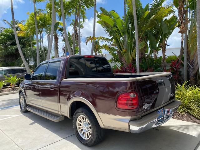 2002 Toreador Red Metallic /Dark Brown Ford F-150 CREW CAB King Ranch LOW MILES 56,886 (1FTRW07L12K) with an 5.4L SEFI OHC V8 Triton Engine engine, Automatic transmission, located at 4701 North Dixie Hwy, Pompano Beach, FL, 33064, (954) 422-2889, 26.240938, -80.123474 - OUR WEBPAGE FLORIDACARS1.COM HAS OVER 100 PHOTOS AND FREE CARFAX LINK 2002 Ford F-150 King Ranch Crew Pickup 5.4L V8 F SOHC 16V Gasoline 19 MPG Rear Wheel Drive Features ABS Brakes Air Conditioning Alloy Wheels AM/FM Stereo Automatic Transmission Bed Liner Cassette Player Cruise Control Leather Seat - Photo#32