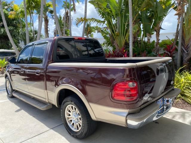 2002 Toreador Red Metallic /Dark Brown Ford F-150 CREW CAB King Ranch LOW MILES 56,886 (1FTRW07L12K) with an 5.4L SEFI OHC V8 Triton Engine engine, Automatic transmission, located at 4701 North Dixie Hwy, Pompano Beach, FL, 33064, (954) 422-2889, 26.240938, -80.123474 - OUR WEBPAGE FLORIDACARS1.COM HAS OVER 100 PHOTOS AND FREE CARFAX LINK 2002 Ford F-150 King Ranch Crew Pickup 5.4L V8 F SOHC 16V Gasoline 19 MPG Rear Wheel Drive Features ABS Brakes Air Conditioning Alloy Wheels AM/FM Stereo Automatic Transmission Bed Liner Cassette Player Cruise Control Leather Seat - Photo#33
