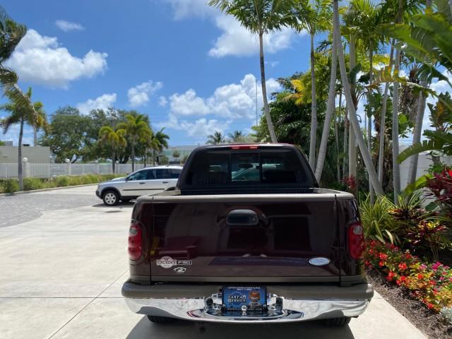 2002 Toreador Red Metallic /Dark Brown Ford F-150 CREW CAB King Ranch LOW MILES 56,886 (1FTRW07L12K) with an 5.4L SEFI OHC V8 Triton Engine engine, Automatic transmission, located at 4701 North Dixie Hwy, Pompano Beach, FL, 33064, (954) 422-2889, 26.240938, -80.123474 - OUR WEBPAGE FLORIDACARS1.COM HAS OVER 100 PHOTOS AND FREE CARFAX LINK 2002 Ford F-150 King Ranch Crew Pickup 5.4L V8 F SOHC 16V Gasoline 19 MPG Rear Wheel Drive Features ABS Brakes Air Conditioning Alloy Wheels AM/FM Stereo Automatic Transmission Bed Liner Cassette Player Cruise Control Leather Seat - Photo#34