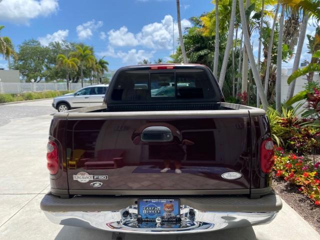 2002 Toreador Red Metallic /Dark Brown Ford F-150 CREW CAB King Ranch LOW MILES 56,886 (1FTRW07L12K) with an 5.4L SEFI OHC V8 Triton Engine engine, Automatic transmission, located at 4701 North Dixie Hwy, Pompano Beach, FL, 33064, (954) 422-2889, 26.240938, -80.123474 - OUR WEBPAGE FLORIDACARS1.COM HAS OVER 100 PHOTOS AND FREE CARFAX LINK 2002 Ford F-150 King Ranch Crew Pickup 5.4L V8 F SOHC 16V Gasoline 19 MPG Rear Wheel Drive Features ABS Brakes Air Conditioning Alloy Wheels AM/FM Stereo Automatic Transmission Bed Liner Cassette Player Cruise Control Leather Seat - Photo#35