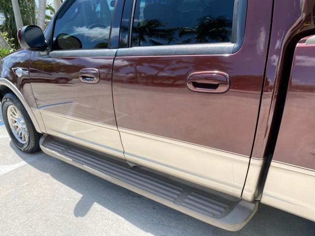 2002 Toreador Red Metallic /Dark Brown Ford F-150 CREW CAB King Ranch LOW MILES 56,886 (1FTRW07L12K) with an 5.4L SEFI OHC V8 Triton Engine engine, Automatic transmission, located at 4701 North Dixie Hwy, Pompano Beach, FL, 33064, (954) 422-2889, 26.240938, -80.123474 - OUR WEBPAGE FLORIDACARS1.COM HAS OVER 100 PHOTOS AND FREE CARFAX LINK 2002 Ford F-150 King Ranch Crew Pickup 5.4L V8 F SOHC 16V Gasoline 19 MPG Rear Wheel Drive Features ABS Brakes Air Conditioning Alloy Wheels AM/FM Stereo Automatic Transmission Bed Liner Cassette Player Cruise Control Leather Seat - Photo#42