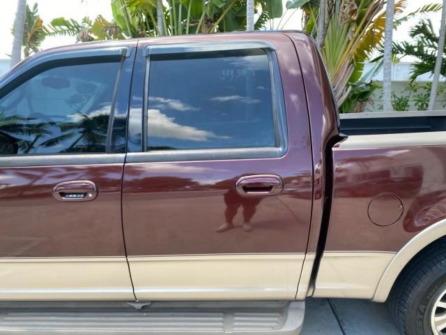 2002 Toreador Red Metallic /Dark Brown Ford F-150 CREW CAB King Ranch LOW MILES 56,886 (1FTRW07L12K) with an 5.4L SEFI OHC V8 Triton Engine engine, Automatic transmission, located at 4701 North Dixie Hwy, Pompano Beach, FL, 33064, (954) 422-2889, 26.240938, -80.123474 - OUR WEBPAGE FLORIDACARS1.COM HAS OVER 100 PHOTOS AND FREE CARFAX LINK 2002 Ford F-150 King Ranch Crew Pickup 5.4L V8 F SOHC 16V Gasoline 19 MPG Rear Wheel Drive Features ABS Brakes Air Conditioning Alloy Wheels AM/FM Stereo Automatic Transmission Bed Liner Cassette Player Cruise Control Leather Seat - Photo#70