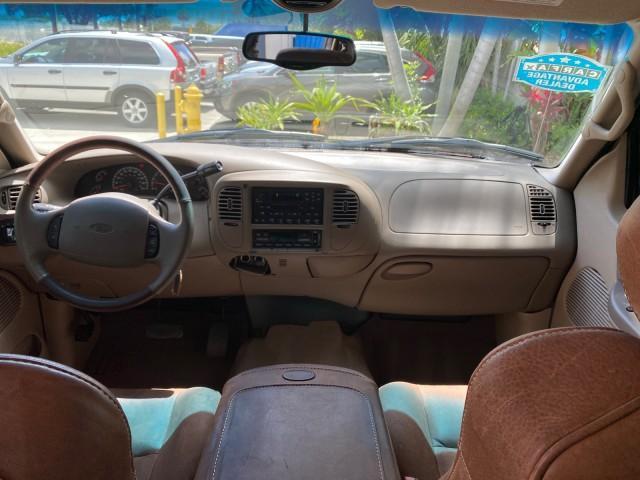 2002 Toreador Red Metallic /Dark Brown Ford F-150 CREW CAB King Ranch LOW MILES 56,886 (1FTRW07L12K) with an 5.4L SEFI OHC V8 Triton Engine engine, Automatic transmission, located at 4701 North Dixie Hwy, Pompano Beach, FL, 33064, (954) 422-2889, 26.240938, -80.123474 - OUR WEBPAGE FLORIDACARS1.COM HAS OVER 100 PHOTOS AND FREE CARFAX LINK 2002 Ford F-150 King Ranch Crew Pickup 5.4L V8 F SOHC 16V Gasoline 19 MPG Rear Wheel Drive Features ABS Brakes Air Conditioning Alloy Wheels AM/FM Stereo Automatic Transmission Bed Liner Cassette Player Cruise Control Leather Seat - Photo#79