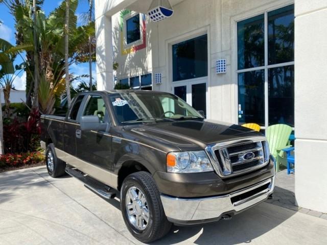 2008 Pueblo Gold Metallic /Tan Ford F-150 4WD Lariat 1 OWNER LOW MILES 83,919 (1FTPX14V58F) with an 5.4L 24-Valve EFI FFV V8 Engine engine, Automatic transmission, located at 4701 North Dixie Hwy, Pompano Beach, FL, 33064, (954) 422-2889, 26.240938, -80.123474 - OUR WEBPAGE FLORIDACARS1.COM HAS OVER 100 PHOTOS AND FREE CARFAX LINK 2008 Ford F-150 Lariat 1 OWNER 4 Door Extended Cab Pickup 5.4L V8 F SOHC Flex Fuel 17 MPG Rear Wheel Drive w/ 4X4 Features 4WD/AWD ABS Brakes Air Conditioning Alloy Wheels AM/FM Stereo Automatic Transmission Auxiliary Audio Input - Photo#2