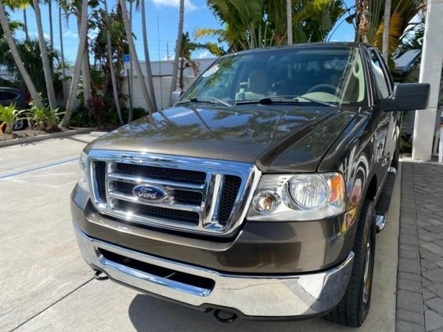 2008 Pueblo Gold Metallic /Tan Ford F-150 4WD Lariat 1 OWNER LOW MILES 83,919 (1FTPX14V58F) with an 5.4L 24-Valve EFI FFV V8 Engine engine, Automatic transmission, located at 4701 North Dixie Hwy, Pompano Beach, FL, 33064, (954) 422-2889, 26.240938, -80.123474 - OUR WEBPAGE FLORIDACARS1.COM HAS OVER 100 PHOTOS AND FREE CARFAX LINK 2008 Ford F-150 Lariat 1 OWNER 4 Door Extended Cab Pickup 5.4L V8 F SOHC Flex Fuel 17 MPG Rear Wheel Drive w/ 4X4 Features 4WD/AWD ABS Brakes Air Conditioning Alloy Wheels AM/FM Stereo Automatic Transmission Auxiliary Audio Input - Photo#3