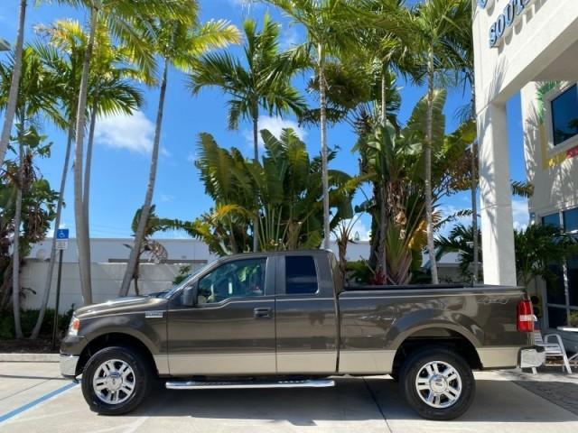 2008 Pueblo Gold Metallic /Tan Ford F-150 4WD Lariat 1 OWNER LOW MILES 83,919 (1FTPX14V58F) with an 5.4L 24-Valve EFI FFV V8 Engine engine, Automatic transmission, located at 4701 North Dixie Hwy, Pompano Beach, FL, 33064, (954) 422-2889, 26.240938, -80.123474 - OUR WEBPAGE FLORIDACARS1.COM HAS OVER 100 PHOTOS AND FREE CARFAX LINK 2008 Ford F-150 Lariat 1 OWNER 4 Door Extended Cab Pickup 5.4L V8 F SOHC Flex Fuel 17 MPG Rear Wheel Drive w/ 4X4 Features 4WD/AWD ABS Brakes Air Conditioning Alloy Wheels AM/FM Stereo Automatic Transmission Auxiliary Audio Input - Photo#4