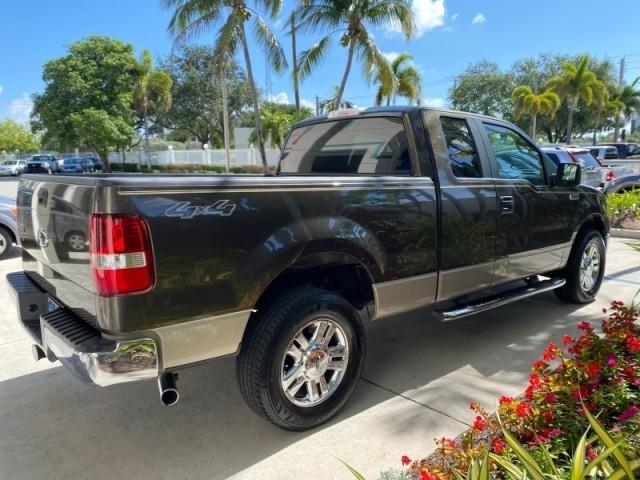 2008 Pueblo Gold Metallic /Tan Ford F-150 4WD Lariat 1 OWNER LOW MILES 83,919 (1FTPX14V58F) with an 5.4L 24-Valve EFI FFV V8 Engine engine, Automatic transmission, located at 4701 North Dixie Hwy, Pompano Beach, FL, 33064, (954) 422-2889, 26.240938, -80.123474 - OUR WEBPAGE FLORIDACARS1.COM HAS OVER 100 PHOTOS AND FREE CARFAX LINK 2008 Ford F-150 Lariat 1 OWNER 4 Door Extended Cab Pickup 5.4L V8 F SOHC Flex Fuel 17 MPG Rear Wheel Drive w/ 4X4 Features 4WD/AWD ABS Brakes Air Conditioning Alloy Wheels AM/FM Stereo Automatic Transmission Auxiliary Audio Input - Photo#7