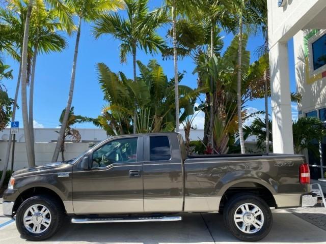 2008 Pueblo Gold Metallic /Tan Ford F-150 4WD Lariat 1 OWNER LOW MILES 83,919 (1FTPX14V58F) with an 5.4L 24-Valve EFI FFV V8 Engine engine, Automatic transmission, located at 4701 North Dixie Hwy, Pompano Beach, FL, 33064, (954) 422-2889, 26.240938, -80.123474 - OUR WEBPAGE FLORIDACARS1.COM HAS OVER 100 PHOTOS AND FREE CARFAX LINK 2008 Ford F-150 Lariat 1 OWNER 4 Door Extended Cab Pickup 5.4L V8 F SOHC Flex Fuel 17 MPG Rear Wheel Drive w/ 4X4 Features 4WD/AWD ABS Brakes Air Conditioning Alloy Wheels AM/FM Stereo Automatic Transmission Auxiliary Audio Input - Photo#30