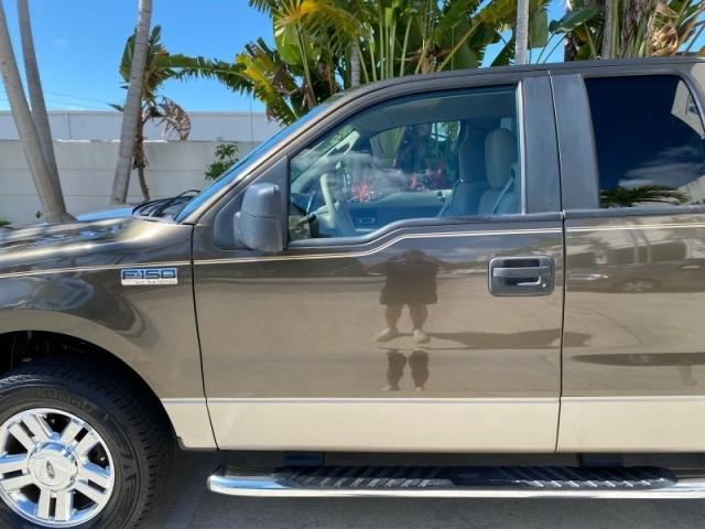 2008 Pueblo Gold Metallic /Tan Ford F-150 4WD Lariat 1 OWNER LOW MILES 83,919 (1FTPX14V58F) with an 5.4L 24-Valve EFI FFV V8 Engine engine, Automatic transmission, located at 4701 North Dixie Hwy, Pompano Beach, FL, 33064, (954) 422-2889, 26.240938, -80.123474 - OUR WEBPAGE FLORIDACARS1.COM HAS OVER 100 PHOTOS AND FREE CARFAX LINK 2008 Ford F-150 Lariat 1 OWNER 4 Door Extended Cab Pickup 5.4L V8 F SOHC Flex Fuel 17 MPG Rear Wheel Drive w/ 4X4 Features 4WD/AWD ABS Brakes Air Conditioning Alloy Wheels AM/FM Stereo Automatic Transmission Auxiliary Audio Input - Photo#37