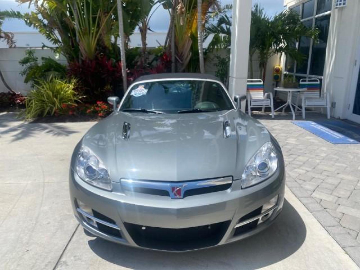 2007 Silver Graphite /Black Saturn Sky CONV LOW MILES 42,288 1 OWNER (1G8MB35B47Y) with an 2.4L DOHC VVT I4 Aluminum Ecotec Engine engine, Automatic transmission, located at 4701 North Dixie Hwy, Pompano Beach, FL, 33064, (954) 422-2889, 26.240938, -80.123474 - OUR WEBPAGE FLORIDACARS1.COM HAS OVER 100 PHOTOS AND FREE CARFAX LINK 2007 Saturn SKY 1 OWNER Convertible 2.4L I4 F DOHC Gasoline 28 MPG Rear Wheel Drive Features ABS Brakes Air Conditioning Alloy Wheels AM/FM Stereo Automatic Transmission Auxiliary Audio Input CD Audio Cruise Control Leather Seats - Photo#2
