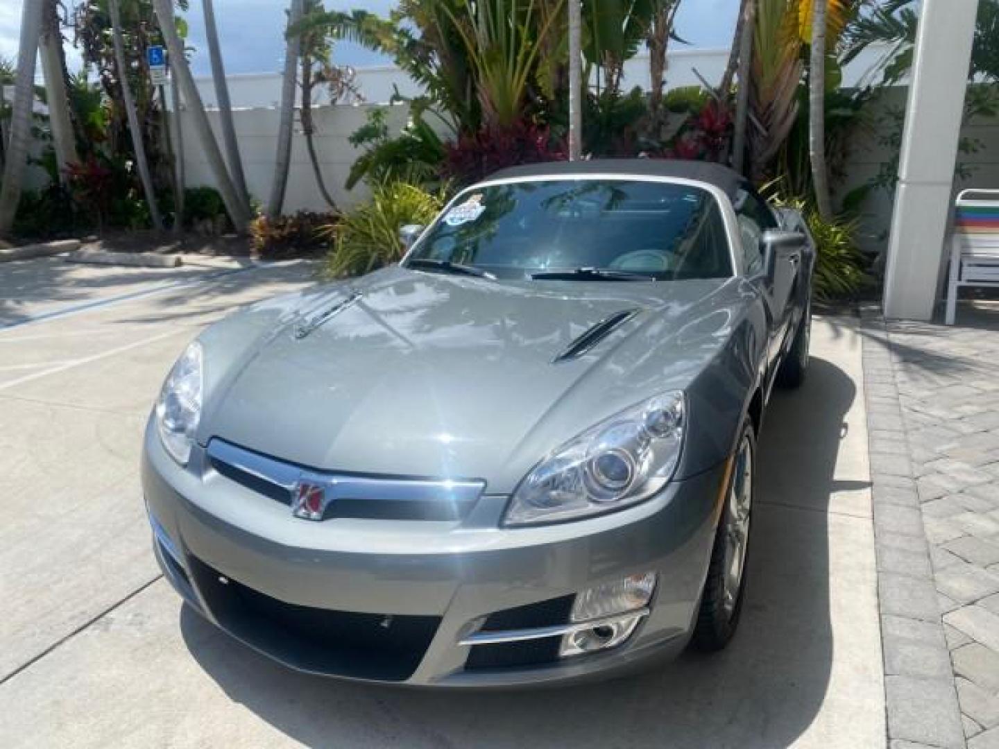 2007 Silver Graphite /Black Saturn Sky CONV LOW MILES 42,288 1 OWNER (1G8MB35B47Y) with an 2.4L DOHC VVT I4 Aluminum Ecotec Engine engine, Automatic transmission, located at 4701 North Dixie Hwy, Pompano Beach, FL, 33064, (954) 422-2889, 26.240938, -80.123474 - OUR WEBPAGE FLORIDACARS1.COM HAS OVER 100 PHOTOS AND FREE CARFAX LINK 2007 Saturn SKY 1 OWNER Convertible 2.4L I4 F DOHC Gasoline 28 MPG Rear Wheel Drive Features ABS Brakes Air Conditioning Alloy Wheels AM/FM Stereo Automatic Transmission Auxiliary Audio Input CD Audio Cruise Control Leather Seats - Photo#3