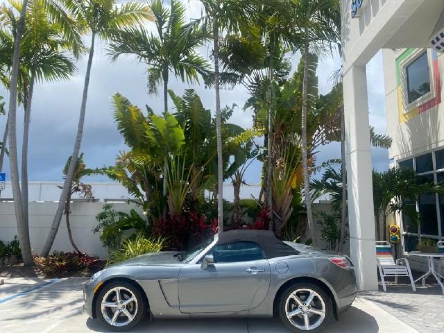 2007 Silver Graphite /Black Saturn Sky CONV LOW MILES 42,288 1 OWNER (1G8MB35B47Y) with an 2.4L DOHC VVT I4 Aluminum Ecotec Engine engine, Automatic transmission, located at 4701 North Dixie Hwy, Pompano Beach, FL, 33064, (954) 422-2889, 26.240938, -80.123474 - OUR WEBPAGE FLORIDACARS1.COM HAS OVER 100 PHOTOS AND FREE CARFAX LINK 2007 Saturn SKY 1 OWNER Convertible 2.4L I4 F DOHC Gasoline 28 MPG Rear Wheel Drive Features ABS Brakes Air Conditioning Alloy Wheels AM/FM Stereo Automatic Transmission Auxiliary Audio Input CD Audio Cruise Control Leather Seats - Photo#4
