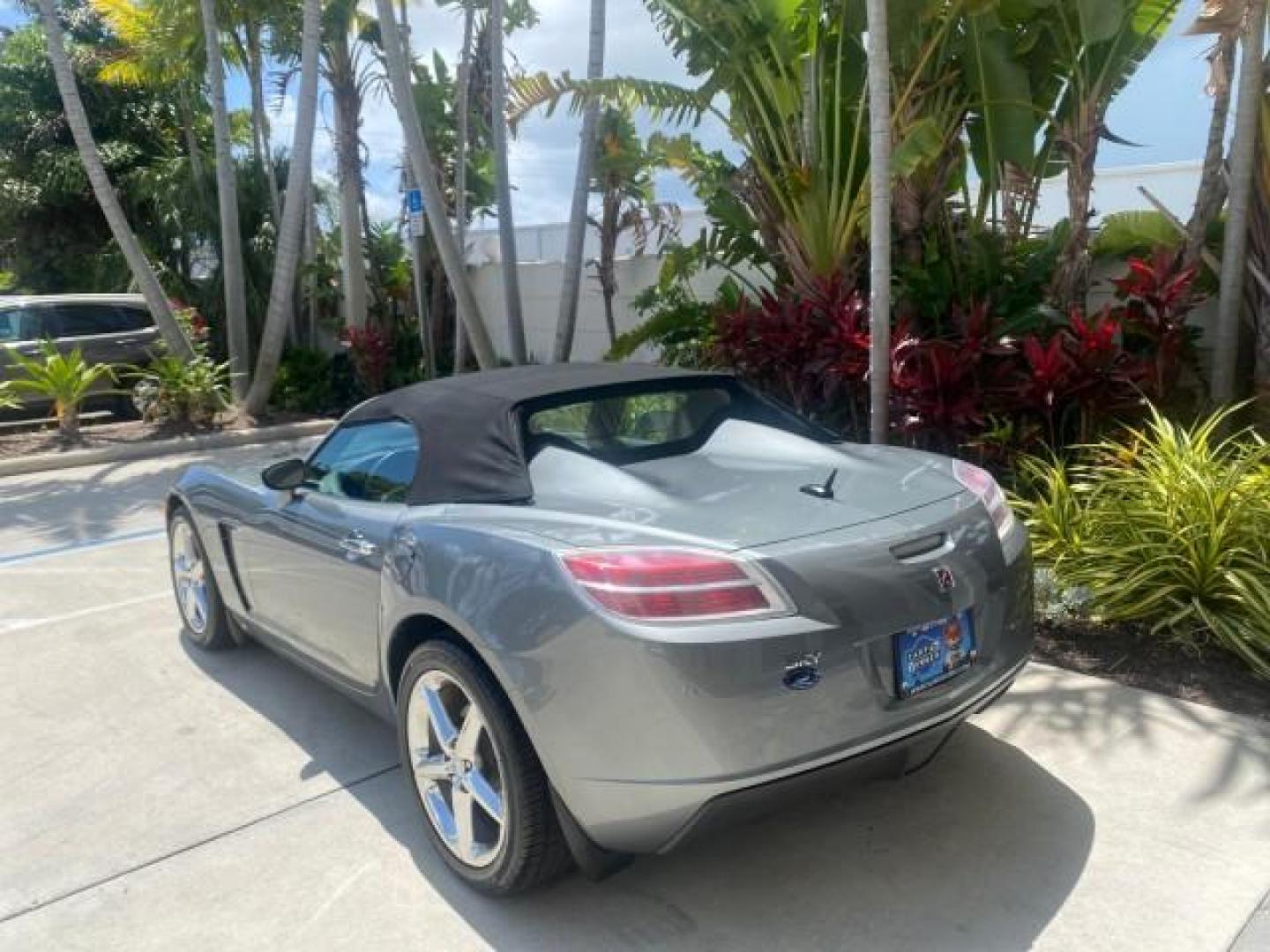 2007 Silver Graphite /Black Saturn Sky CONV LOW MILES 42,288 1 OWNER (1G8MB35B47Y) with an 2.4L DOHC VVT I4 Aluminum Ecotec Engine engine, Automatic transmission, located at 4701 North Dixie Hwy, Pompano Beach, FL, 33064, (954) 422-2889, 26.240938, -80.123474 - OUR WEBPAGE FLORIDACARS1.COM HAS OVER 100 PHOTOS AND FREE CARFAX LINK 2007 Saturn SKY 1 OWNER Convertible 2.4L I4 F DOHC Gasoline 28 MPG Rear Wheel Drive Features ABS Brakes Air Conditioning Alloy Wheels AM/FM Stereo Automatic Transmission Auxiliary Audio Input CD Audio Cruise Control Leather Seats - Photo#5