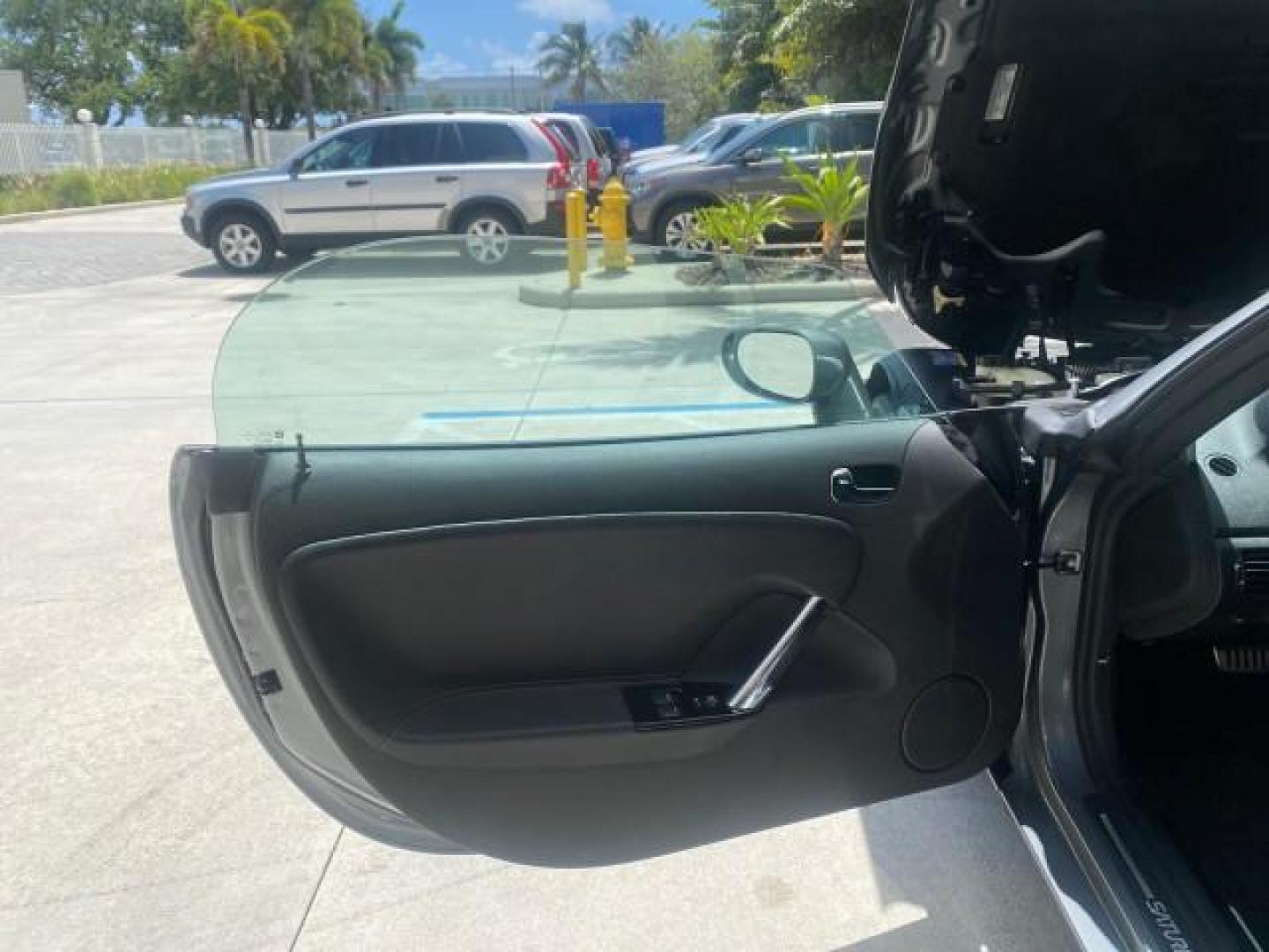 2007 Silver Graphite /Black Saturn Sky CONV LOW MILES 42,288 1 OWNER (1G8MB35B47Y) with an 2.4L DOHC VVT I4 Aluminum Ecotec Engine engine, Automatic transmission, located at 4701 North Dixie Hwy, Pompano Beach, FL, 33064, (954) 422-2889, 26.240938, -80.123474 - OUR WEBPAGE FLORIDACARS1.COM HAS OVER 100 PHOTOS AND FREE CARFAX LINK 2007 Saturn SKY 1 OWNER Convertible 2.4L I4 F DOHC Gasoline 28 MPG Rear Wheel Drive Features ABS Brakes Air Conditioning Alloy Wheels AM/FM Stereo Automatic Transmission Auxiliary Audio Input CD Audio Cruise Control Leather Seats - Photo#9