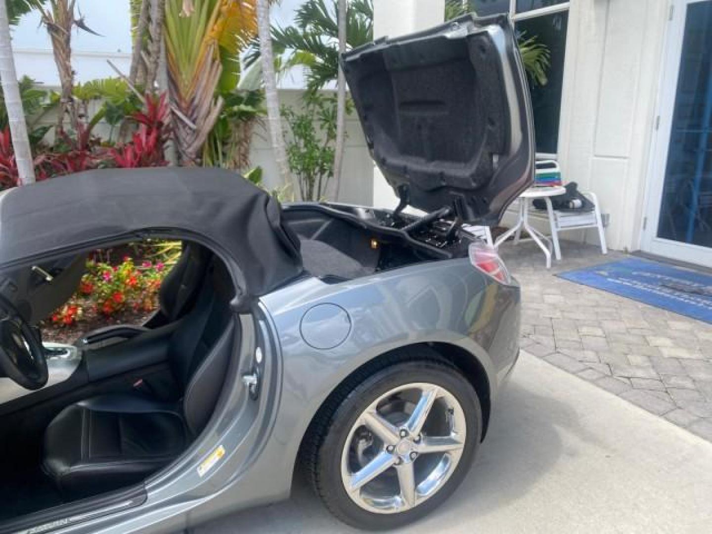 2007 Silver Graphite /Black Saturn Sky CONV LOW MILES 42,288 1 OWNER (1G8MB35B47Y) with an 2.4L DOHC VVT I4 Aluminum Ecotec Engine engine, Automatic transmission, located at 4701 North Dixie Hwy, Pompano Beach, FL, 33064, (954) 422-2889, 26.240938, -80.123474 - OUR WEBPAGE FLORIDACARS1.COM HAS OVER 100 PHOTOS AND FREE CARFAX LINK 2007 Saturn SKY 1 OWNER Convertible 2.4L I4 F DOHC Gasoline 28 MPG Rear Wheel Drive Features ABS Brakes Air Conditioning Alloy Wheels AM/FM Stereo Automatic Transmission Auxiliary Audio Input CD Audio Cruise Control Leather Seats - Photo#13
