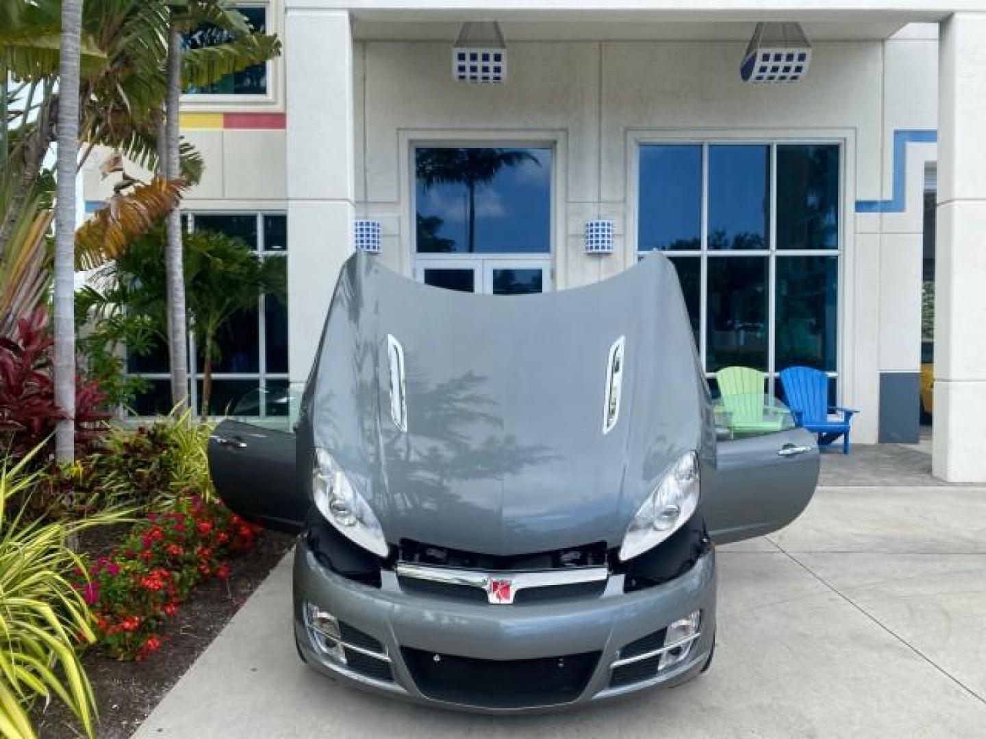 2007 Silver Graphite /Black Saturn Sky CONV LOW MILES 42,288 1 OWNER (1G8MB35B47Y) with an 2.4L DOHC VVT I4 Aluminum Ecotec Engine engine, Automatic transmission, located at 4701 North Dixie Hwy, Pompano Beach, FL, 33064, (954) 422-2889, 26.240938, -80.123474 - OUR WEBPAGE FLORIDACARS1.COM HAS OVER 100 PHOTOS AND FREE CARFAX LINK 2007 Saturn SKY 1 OWNER Convertible 2.4L I4 F DOHC Gasoline 28 MPG Rear Wheel Drive Features ABS Brakes Air Conditioning Alloy Wheels AM/FM Stereo Automatic Transmission Auxiliary Audio Input CD Audio Cruise Control Leather Seats - Photo#16