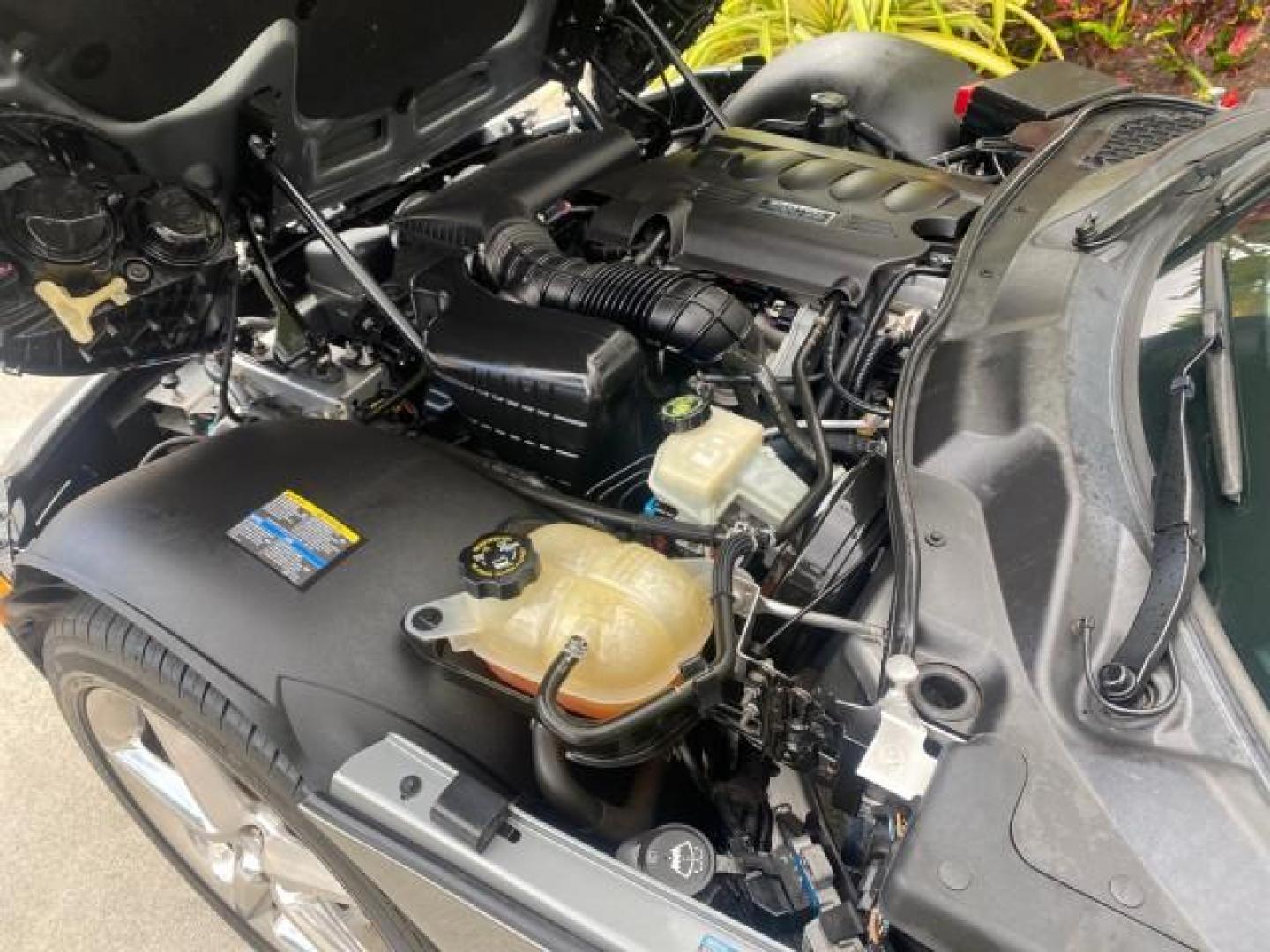 2007 Silver Graphite /Black Saturn Sky CONV LOW MILES 42,288 1 OWNER (1G8MB35B47Y) with an 2.4L DOHC VVT I4 Aluminum Ecotec Engine engine, Automatic transmission, located at 4701 North Dixie Hwy, Pompano Beach, FL, 33064, (954) 422-2889, 26.240938, -80.123474 - OUR WEBPAGE FLORIDACARS1.COM HAS OVER 100 PHOTOS AND FREE CARFAX LINK 2007 Saturn SKY 1 OWNER Convertible 2.4L I4 F DOHC Gasoline 28 MPG Rear Wheel Drive Features ABS Brakes Air Conditioning Alloy Wheels AM/FM Stereo Automatic Transmission Auxiliary Audio Input CD Audio Cruise Control Leather Seats - Photo#24