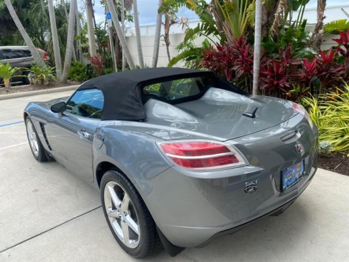 2007 Silver Graphite /Black Saturn Sky CONV LOW MILES 42,288 1 OWNER (1G8MB35B47Y) with an 2.4L DOHC VVT I4 Aluminum Ecotec Engine engine, Automatic transmission, located at 4701 North Dixie Hwy, Pompano Beach, FL, 33064, (954) 422-2889, 26.240938, -80.123474 - OUR WEBPAGE FLORIDACARS1.COM HAS OVER 100 PHOTOS AND FREE CARFAX LINK 2007 Saturn SKY 1 OWNER Convertible 2.4L I4 F DOHC Gasoline 28 MPG Rear Wheel Drive Features ABS Brakes Air Conditioning Alloy Wheels AM/FM Stereo Automatic Transmission Auxiliary Audio Input CD Audio Cruise Control Leather Seats - Photo#33