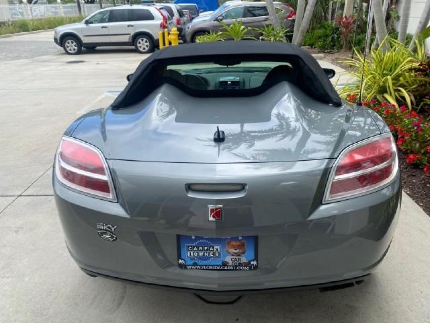 2007 Silver Graphite /Black Saturn Sky CONV LOW MILES 42,288 1 OWNER (1G8MB35B47Y) with an 2.4L DOHC VVT I4 Aluminum Ecotec Engine engine, Automatic transmission, located at 4701 North Dixie Hwy, Pompano Beach, FL, 33064, (954) 422-2889, 26.240938, -80.123474 - OUR WEBPAGE FLORIDACARS1.COM HAS OVER 100 PHOTOS AND FREE CARFAX LINK 2007 Saturn SKY 1 OWNER Convertible 2.4L I4 F DOHC Gasoline 28 MPG Rear Wheel Drive Features ABS Brakes Air Conditioning Alloy Wheels AM/FM Stereo Automatic Transmission Auxiliary Audio Input CD Audio Cruise Control Leather Seats - Photo#35