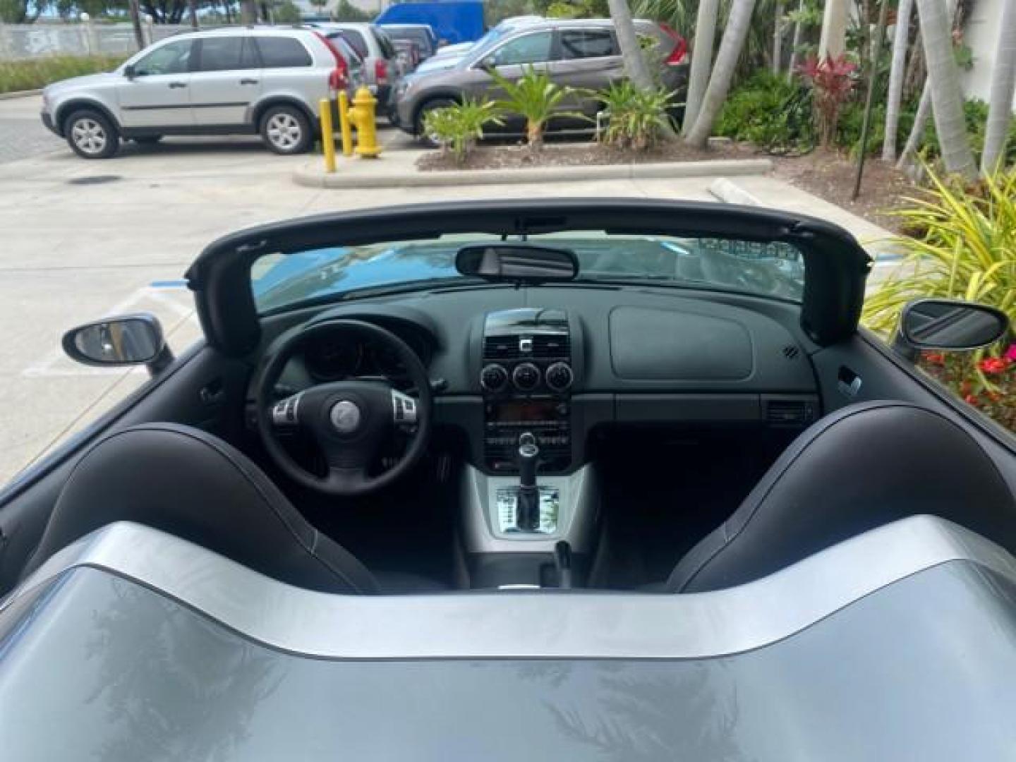 2007 Silver Graphite /Black Saturn Sky CONV LOW MILES 42,288 1 OWNER (1G8MB35B47Y) with an 2.4L DOHC VVT I4 Aluminum Ecotec Engine engine, Automatic transmission, located at 4701 North Dixie Hwy, Pompano Beach, FL, 33064, (954) 422-2889, 26.240938, -80.123474 - OUR WEBPAGE FLORIDACARS1.COM HAS OVER 100 PHOTOS AND FREE CARFAX LINK 2007 Saturn SKY 1 OWNER Convertible 2.4L I4 F DOHC Gasoline 28 MPG Rear Wheel Drive Features ABS Brakes Air Conditioning Alloy Wheels AM/FM Stereo Automatic Transmission Auxiliary Audio Input CD Audio Cruise Control Leather Seats - Photo#46