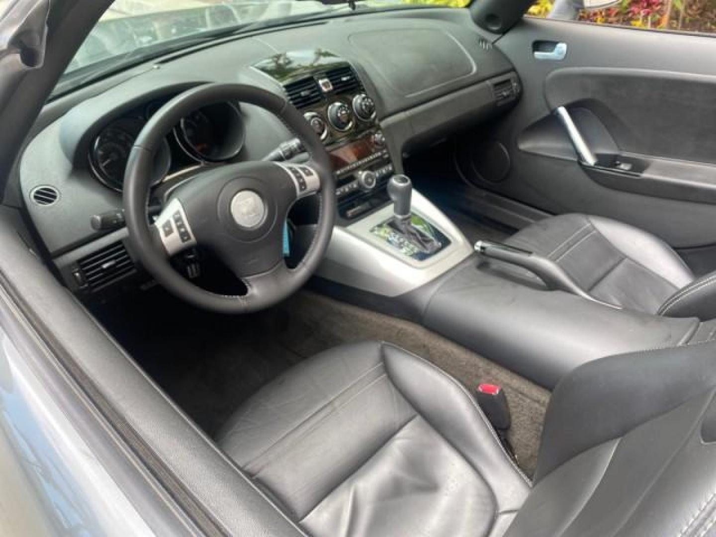 2007 Silver Graphite /Black Saturn Sky CONV LOW MILES 42,288 1 OWNER (1G8MB35B47Y) with an 2.4L DOHC VVT I4 Aluminum Ecotec Engine engine, Automatic transmission, located at 4701 North Dixie Hwy, Pompano Beach, FL, 33064, (954) 422-2889, 26.240938, -80.123474 - OUR WEBPAGE FLORIDACARS1.COM HAS OVER 100 PHOTOS AND FREE CARFAX LINK 2007 Saturn SKY 1 OWNER Convertible 2.4L I4 F DOHC Gasoline 28 MPG Rear Wheel Drive Features ABS Brakes Air Conditioning Alloy Wheels AM/FM Stereo Automatic Transmission Auxiliary Audio Input CD Audio Cruise Control Leather Seats - Photo#47
