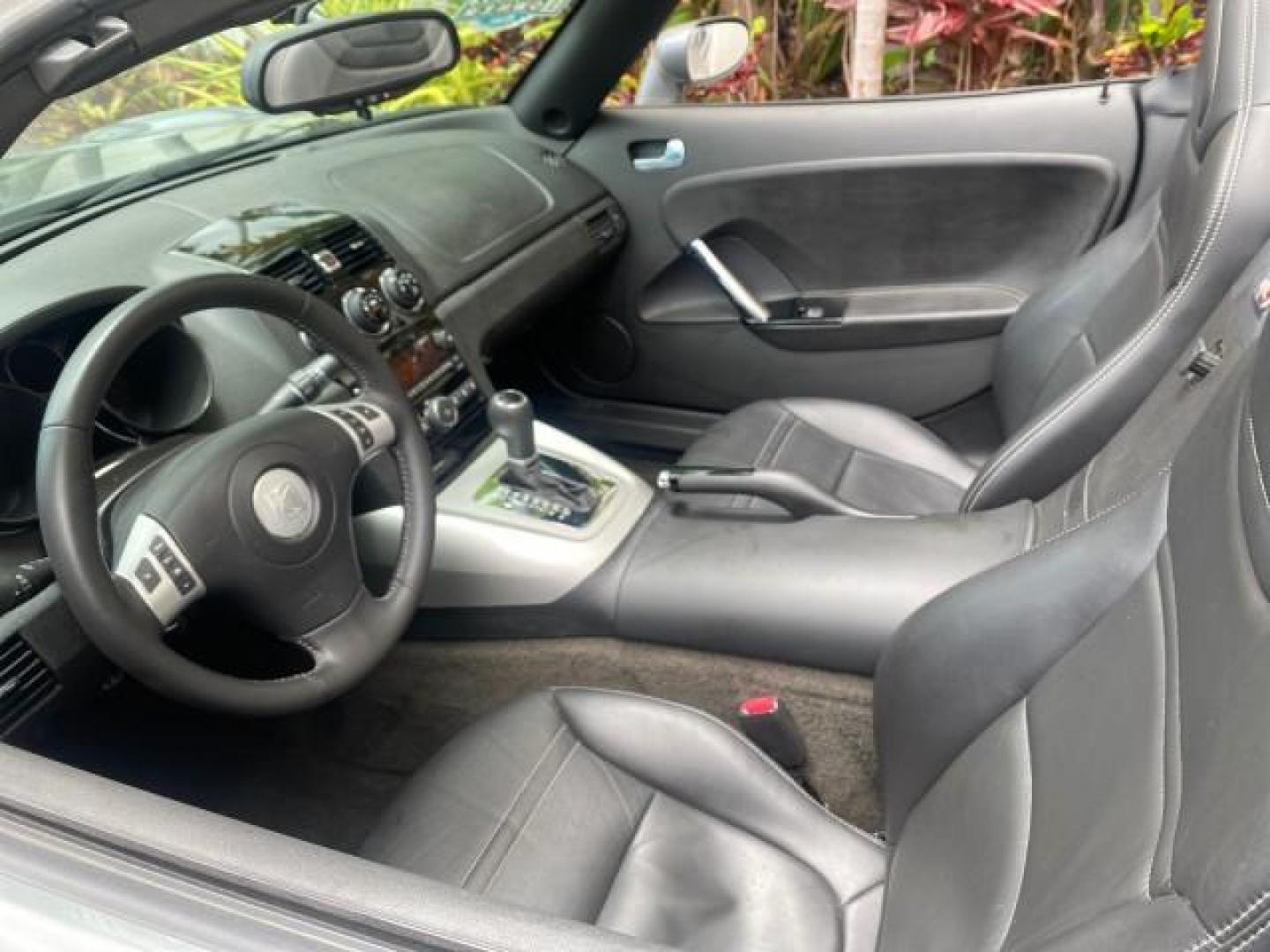 2007 Silver Graphite /Black Saturn Sky CONV LOW MILES 42,288 1 OWNER (1G8MB35B47Y) with an 2.4L DOHC VVT I4 Aluminum Ecotec Engine engine, Automatic transmission, located at 4701 North Dixie Hwy, Pompano Beach, FL, 33064, (954) 422-2889, 26.240938, -80.123474 - OUR WEBPAGE FLORIDACARS1.COM HAS OVER 100 PHOTOS AND FREE CARFAX LINK 2007 Saturn SKY 1 OWNER Convertible 2.4L I4 F DOHC Gasoline 28 MPG Rear Wheel Drive Features ABS Brakes Air Conditioning Alloy Wheels AM/FM Stereo Automatic Transmission Auxiliary Audio Input CD Audio Cruise Control Leather Seats - Photo#48