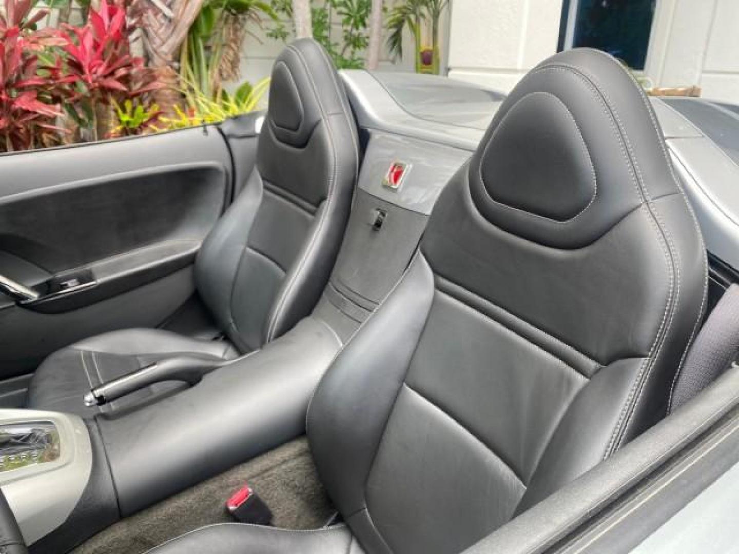2007 Silver Graphite /Black Saturn Sky CONV LOW MILES 42,288 1 OWNER (1G8MB35B47Y) with an 2.4L DOHC VVT I4 Aluminum Ecotec Engine engine, Automatic transmission, located at 4701 North Dixie Hwy, Pompano Beach, FL, 33064, (954) 422-2889, 26.240938, -80.123474 - OUR WEBPAGE FLORIDACARS1.COM HAS OVER 100 PHOTOS AND FREE CARFAX LINK 2007 Saturn SKY 1 OWNER Convertible 2.4L I4 F DOHC Gasoline 28 MPG Rear Wheel Drive Features ABS Brakes Air Conditioning Alloy Wheels AM/FM Stereo Automatic Transmission Auxiliary Audio Input CD Audio Cruise Control Leather Seats - Photo#49