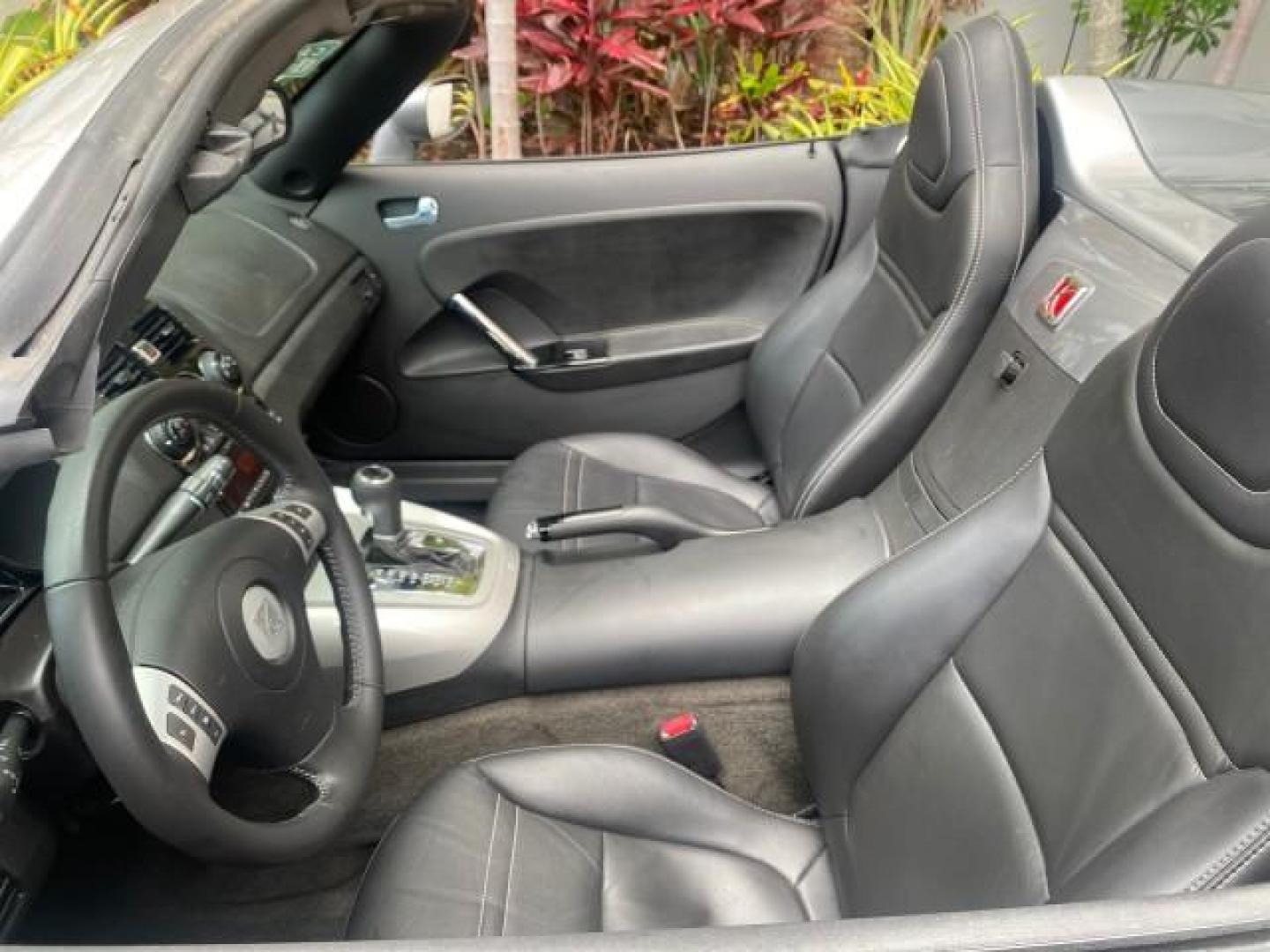 2007 Silver Graphite /Black Saturn Sky CONV LOW MILES 42,288 1 OWNER (1G8MB35B47Y) with an 2.4L DOHC VVT I4 Aluminum Ecotec Engine engine, Automatic transmission, located at 4701 North Dixie Hwy, Pompano Beach, FL, 33064, (954) 422-2889, 26.240938, -80.123474 - OUR WEBPAGE FLORIDACARS1.COM HAS OVER 100 PHOTOS AND FREE CARFAX LINK 2007 Saturn SKY 1 OWNER Convertible 2.4L I4 F DOHC Gasoline 28 MPG Rear Wheel Drive Features ABS Brakes Air Conditioning Alloy Wheels AM/FM Stereo Automatic Transmission Auxiliary Audio Input CD Audio Cruise Control Leather Seats - Photo#50