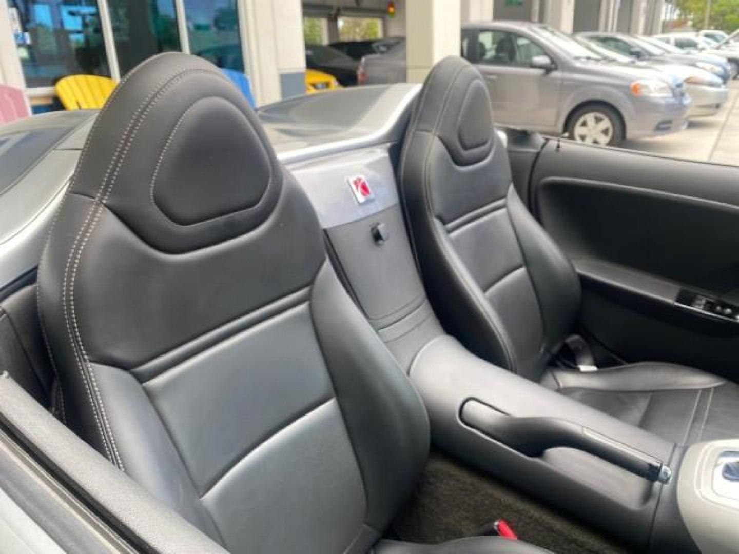 2007 Silver Graphite /Black Saturn Sky CONV LOW MILES 42,288 1 OWNER (1G8MB35B47Y) with an 2.4L DOHC VVT I4 Aluminum Ecotec Engine engine, Automatic transmission, located at 4701 North Dixie Hwy, Pompano Beach, FL, 33064, (954) 422-2889, 26.240938, -80.123474 - OUR WEBPAGE FLORIDACARS1.COM HAS OVER 100 PHOTOS AND FREE CARFAX LINK 2007 Saturn SKY 1 OWNER Convertible 2.4L I4 F DOHC Gasoline 28 MPG Rear Wheel Drive Features ABS Brakes Air Conditioning Alloy Wheels AM/FM Stereo Automatic Transmission Auxiliary Audio Input CD Audio Cruise Control Leather Seats - Photo#51
