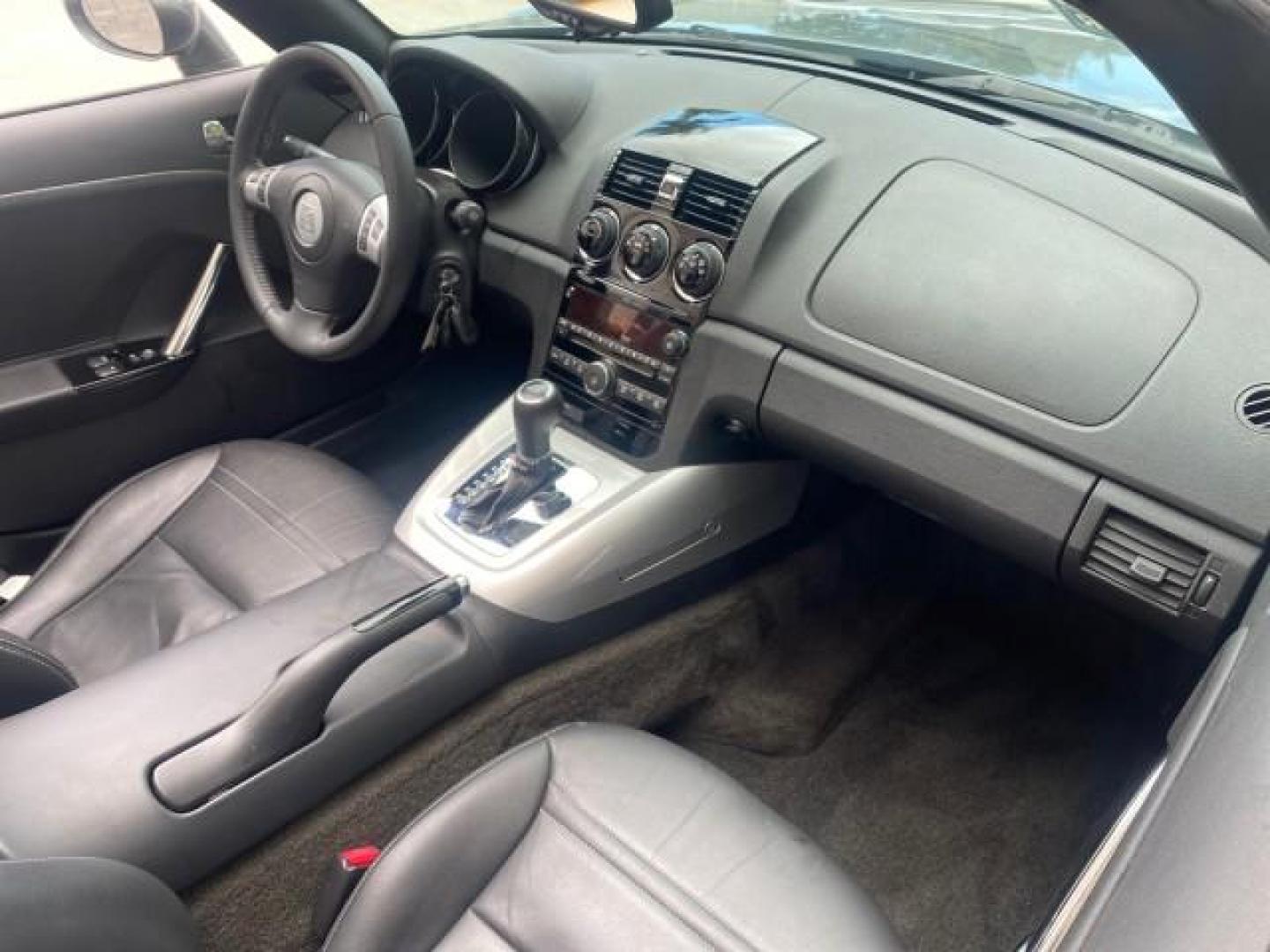 2007 Silver Graphite /Black Saturn Sky CONV LOW MILES 42,288 1 OWNER (1G8MB35B47Y) with an 2.4L DOHC VVT I4 Aluminum Ecotec Engine engine, Automatic transmission, located at 4701 North Dixie Hwy, Pompano Beach, FL, 33064, (954) 422-2889, 26.240938, -80.123474 - OUR WEBPAGE FLORIDACARS1.COM HAS OVER 100 PHOTOS AND FREE CARFAX LINK 2007 Saturn SKY 1 OWNER Convertible 2.4L I4 F DOHC Gasoline 28 MPG Rear Wheel Drive Features ABS Brakes Air Conditioning Alloy Wheels AM/FM Stereo Automatic Transmission Auxiliary Audio Input CD Audio Cruise Control Leather Seats - Photo#53