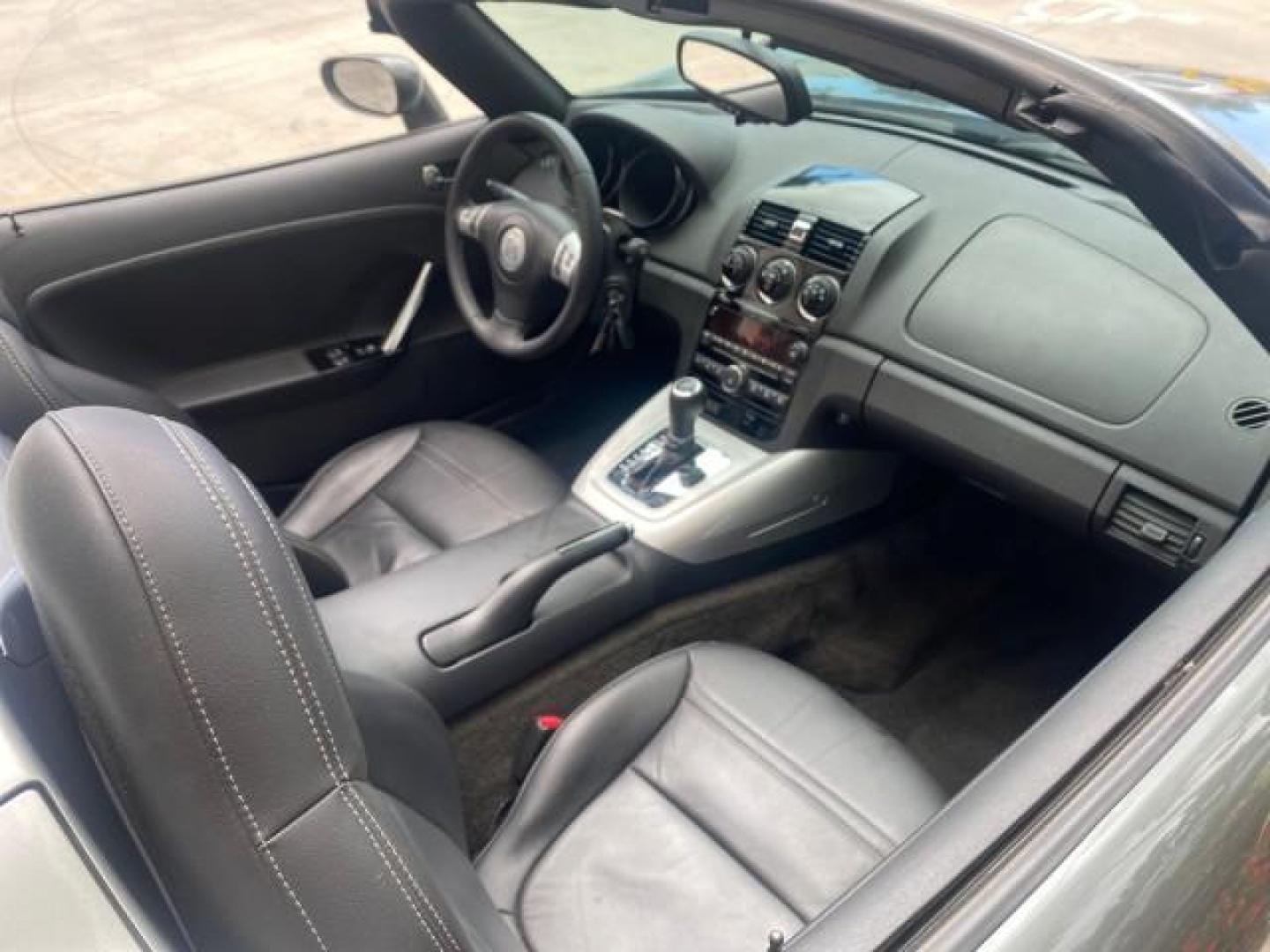 2007 Silver Graphite /Black Saturn Sky CONV LOW MILES 42,288 1 OWNER (1G8MB35B47Y) with an 2.4L DOHC VVT I4 Aluminum Ecotec Engine engine, Automatic transmission, located at 4701 North Dixie Hwy, Pompano Beach, FL, 33064, (954) 422-2889, 26.240938, -80.123474 - OUR WEBPAGE FLORIDACARS1.COM HAS OVER 100 PHOTOS AND FREE CARFAX LINK 2007 Saturn SKY 1 OWNER Convertible 2.4L I4 F DOHC Gasoline 28 MPG Rear Wheel Drive Features ABS Brakes Air Conditioning Alloy Wheels AM/FM Stereo Automatic Transmission Auxiliary Audio Input CD Audio Cruise Control Leather Seats - Photo#54