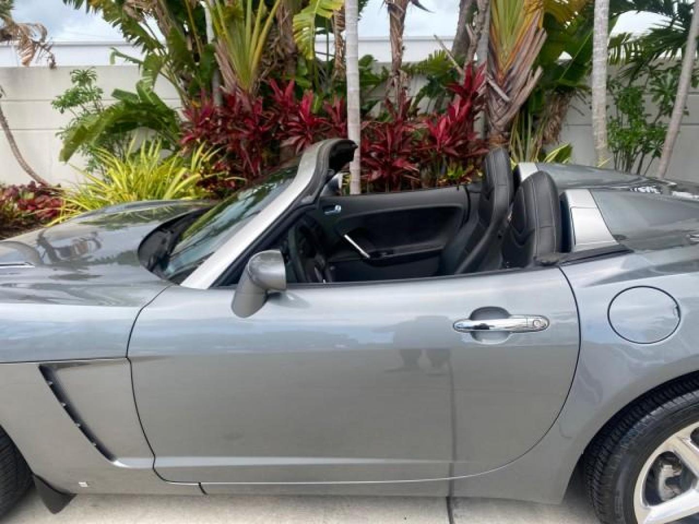 2007 Silver Graphite /Black Saturn Sky CONV LOW MILES 42,288 1 OWNER (1G8MB35B47Y) with an 2.4L DOHC VVT I4 Aluminum Ecotec Engine engine, Automatic transmission, located at 4701 North Dixie Hwy, Pompano Beach, FL, 33064, (954) 422-2889, 26.240938, -80.123474 - OUR WEBPAGE FLORIDACARS1.COM HAS OVER 100 PHOTOS AND FREE CARFAX LINK 2007 Saturn SKY 1 OWNER Convertible 2.4L I4 F DOHC Gasoline 28 MPG Rear Wheel Drive Features ABS Brakes Air Conditioning Alloy Wheels AM/FM Stereo Automatic Transmission Auxiliary Audio Input CD Audio Cruise Control Leather Seats - Photo#56