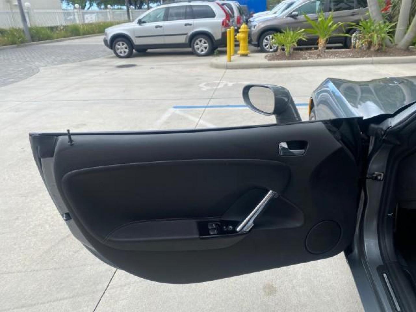 2007 Silver Graphite /Black Saturn Sky CONV LOW MILES 42,288 1 OWNER (1G8MB35B47Y) with an 2.4L DOHC VVT I4 Aluminum Ecotec Engine engine, Automatic transmission, located at 4701 North Dixie Hwy, Pompano Beach, FL, 33064, (954) 422-2889, 26.240938, -80.123474 - OUR WEBPAGE FLORIDACARS1.COM HAS OVER 100 PHOTOS AND FREE CARFAX LINK 2007 Saturn SKY 1 OWNER Convertible 2.4L I4 F DOHC Gasoline 28 MPG Rear Wheel Drive Features ABS Brakes Air Conditioning Alloy Wheels AM/FM Stereo Automatic Transmission Auxiliary Audio Input CD Audio Cruise Control Leather Seats - Photo#61