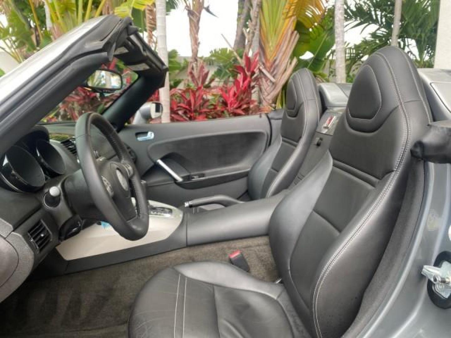 2007 Silver Graphite /Black Saturn Sky CONV LOW MILES 42,288 1 OWNER (1G8MB35B47Y) with an 2.4L DOHC VVT I4 Aluminum Ecotec Engine engine, Automatic transmission, located at 4701 North Dixie Hwy, Pompano Beach, FL, 33064, (954) 422-2889, 26.240938, -80.123474 - OUR WEBPAGE FLORIDACARS1.COM HAS OVER 100 PHOTOS AND FREE CARFAX LINK 2007 Saturn SKY 1 OWNER Convertible 2.4L I4 F DOHC Gasoline 28 MPG Rear Wheel Drive Features ABS Brakes Air Conditioning Alloy Wheels AM/FM Stereo Automatic Transmission Auxiliary Audio Input CD Audio Cruise Control Leather Seats - Photo#63
