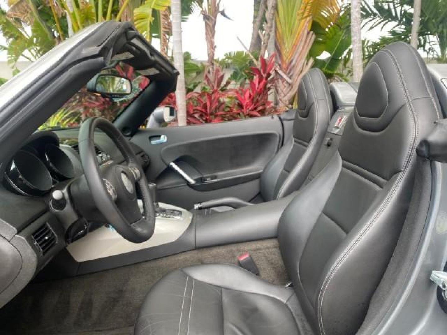 2007 Silver Graphite /Black Saturn Sky CONV LOW MILES 42,288 1 OWNER (1G8MB35B47Y) with an 2.4L DOHC VVT I4 Aluminum Ecotec Engine engine, Automatic transmission, located at 4701 North Dixie Hwy, Pompano Beach, FL, 33064, (954) 422-2889, 26.240938, -80.123474 - OUR WEBPAGE FLORIDACARS1.COM HAS OVER 100 PHOTOS AND FREE CARFAX LINK 2007 Saturn SKY 1 OWNER Convertible 2.4L I4 F DOHC Gasoline 28 MPG Rear Wheel Drive Features ABS Brakes Air Conditioning Alloy Wheels AM/FM Stereo Automatic Transmission Auxiliary Audio Input CD Audio Cruise Control Leather Seats - Photo#64