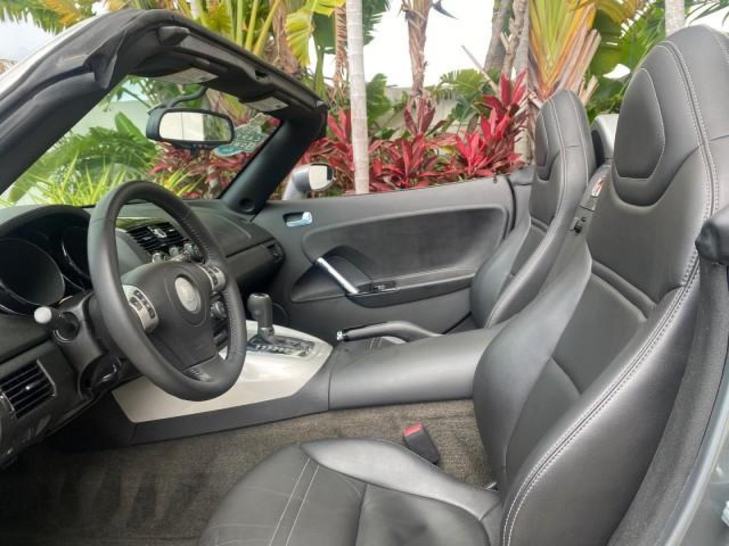 2007 Silver Graphite /Black Saturn Sky CONV LOW MILES 42,288 1 OWNER (1G8MB35B47Y) with an 2.4L DOHC VVT I4 Aluminum Ecotec Engine engine, Automatic transmission, located at 4701 North Dixie Hwy, Pompano Beach, FL, 33064, (954) 422-2889, 26.240938, -80.123474 - OUR WEBPAGE FLORIDACARS1.COM HAS OVER 100 PHOTOS AND FREE CARFAX LINK 2007 Saturn SKY 1 OWNER Convertible 2.4L I4 F DOHC Gasoline 28 MPG Rear Wheel Drive Features ABS Brakes Air Conditioning Alloy Wheels AM/FM Stereo Automatic Transmission Auxiliary Audio Input CD Audio Cruise Control Leather Seats - Photo#65