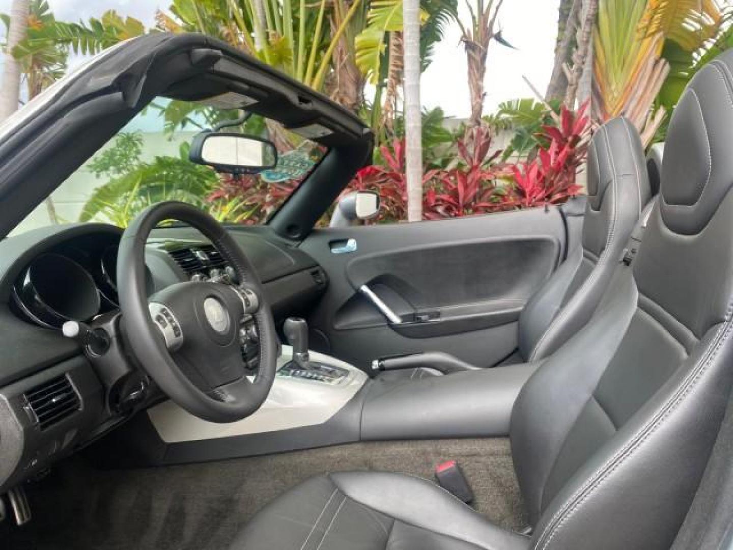 2007 Silver Graphite /Black Saturn Sky CONV LOW MILES 42,288 1 OWNER (1G8MB35B47Y) with an 2.4L DOHC VVT I4 Aluminum Ecotec Engine engine, Automatic transmission, located at 4701 North Dixie Hwy, Pompano Beach, FL, 33064, (954) 422-2889, 26.240938, -80.123474 - OUR WEBPAGE FLORIDACARS1.COM HAS OVER 100 PHOTOS AND FREE CARFAX LINK 2007 Saturn SKY 1 OWNER Convertible 2.4L I4 F DOHC Gasoline 28 MPG Rear Wheel Drive Features ABS Brakes Air Conditioning Alloy Wheels AM/FM Stereo Automatic Transmission Auxiliary Audio Input CD Audio Cruise Control Leather Seats - Photo#66
