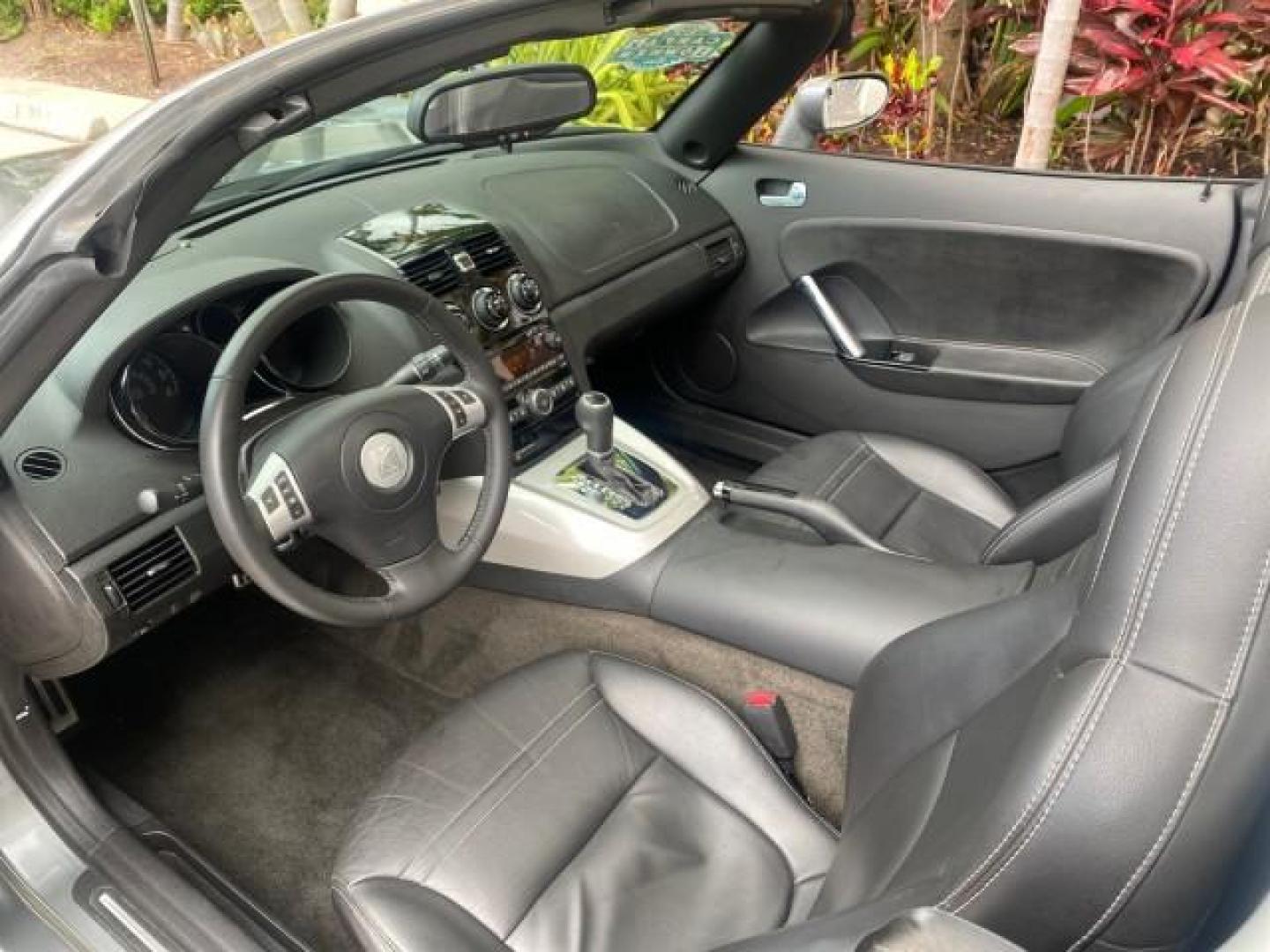 2007 Silver Graphite /Black Saturn Sky CONV LOW MILES 42,288 1 OWNER (1G8MB35B47Y) with an 2.4L DOHC VVT I4 Aluminum Ecotec Engine engine, Automatic transmission, located at 4701 North Dixie Hwy, Pompano Beach, FL, 33064, (954) 422-2889, 26.240938, -80.123474 - OUR WEBPAGE FLORIDACARS1.COM HAS OVER 100 PHOTOS AND FREE CARFAX LINK 2007 Saturn SKY 1 OWNER Convertible 2.4L I4 F DOHC Gasoline 28 MPG Rear Wheel Drive Features ABS Brakes Air Conditioning Alloy Wheels AM/FM Stereo Automatic Transmission Auxiliary Audio Input CD Audio Cruise Control Leather Seats - Photo#67