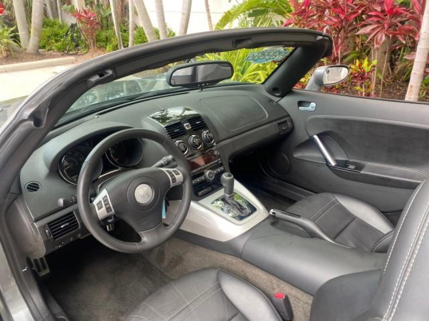 2007 Silver Graphite /Black Saturn Sky CONV LOW MILES 42,288 1 OWNER (1G8MB35B47Y) with an 2.4L DOHC VVT I4 Aluminum Ecotec Engine engine, Automatic transmission, located at 4701 North Dixie Hwy, Pompano Beach, FL, 33064, (954) 422-2889, 26.240938, -80.123474 - OUR WEBPAGE FLORIDACARS1.COM HAS OVER 100 PHOTOS AND FREE CARFAX LINK 2007 Saturn SKY 1 OWNER Convertible 2.4L I4 F DOHC Gasoline 28 MPG Rear Wheel Drive Features ABS Brakes Air Conditioning Alloy Wheels AM/FM Stereo Automatic Transmission Auxiliary Audio Input CD Audio Cruise Control Leather Seats - Photo#68